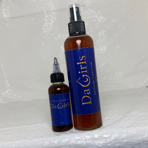 Two bottles with blue labels and black nozzles on a white foam block.