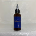 Bottle of Da Girl hair product on a textured white surface